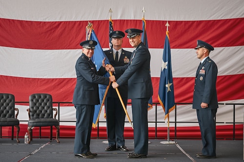A guidon is passed during a change of command ceremony.