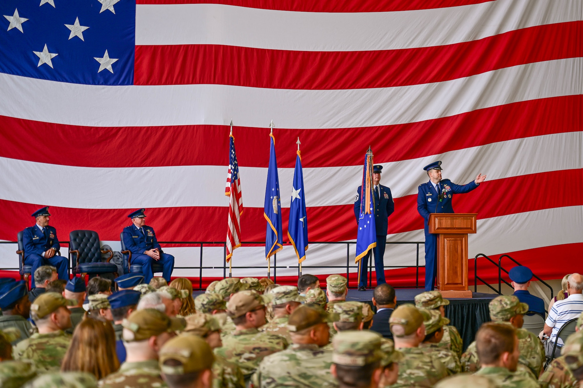 A commander address an audience during a military ceremony.