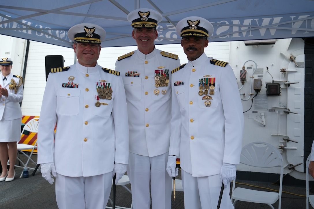 The Coast Guard Cutter Hamilton held a change of command ceremony in Panama on July 9, 2025. During the ceremony, which was presided over by Vice Adm. Nathan Moore, the commander of Coast Guard Atlantic Area, Capt. Justin M. Carter (left) was relieved by Capt. John B. McWhite (right). (U.S. Coast Guard photo by Petty Officer 2nd Class Jackson Ludwig)