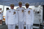The Coast Guard Cutter Hamilton held a change of command ceremony in Panama on July 9, 2025. During the ceremony, which was presided over by Vice Adm. Nathan Moore, the commander of Coast Guard Atlantic Area, Capt. Justin M. Carter (left) was relieved by Capt. John B. McWhite (right). (U.S. Coast Guard photo by Petty Officer 2nd Class Jackson Ludwig)