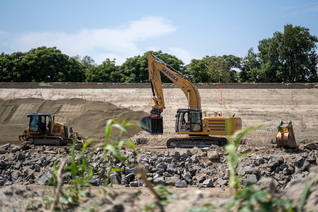An excavator smooths bedding material May 1 on the slope of a levee in Riverside, California, where the U.S. Corps of Engineers Los Angeles District, Riverside County Flood Control and Water Conservation District and contractors have started work again for the levee rehabilitation project.