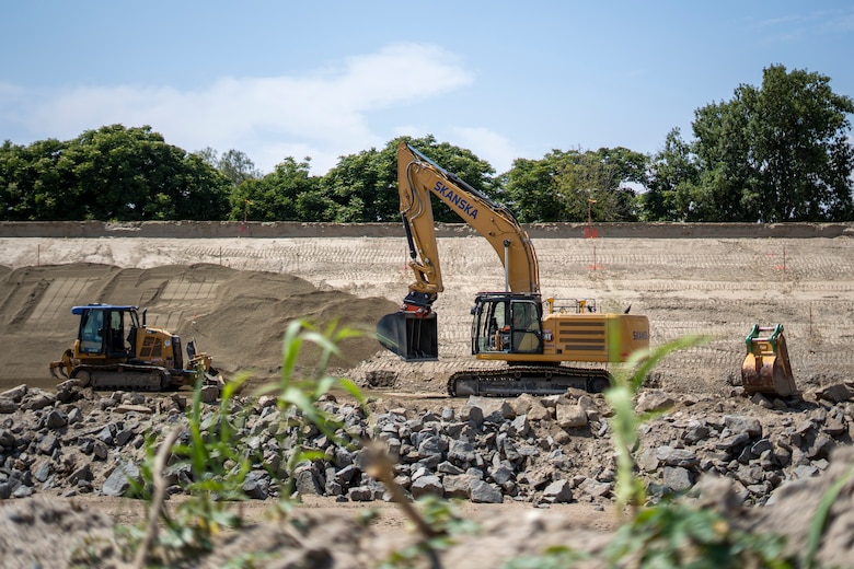 An excavator smooths bedding material May 1 on the slope of a levee in Riverside, California, where the U.S. Corps of Engineers Los Angeles District, Riverside County Flood Control and Water Conservation District and contractors have started work again for the levee rehabilitation project.