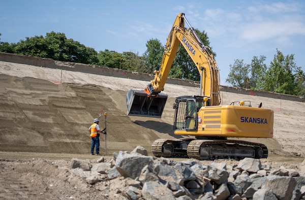 An excavator smooths bedding material May 1 on the slope of a levee in Riverside, California, where the U.S. Corps of Engineers Los Angeles District, Riverside County Flood Control and Water Conservation District and contractors have started work again for the levee rehabilitation project.