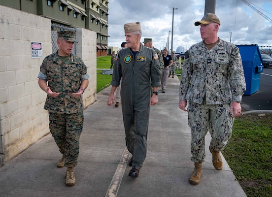 Adm. Steve Koehler, commander, U.S. Pacific Fleet, middle, Marine Corps Col. Ernest Govea, commanding officer, Marine Corps Base Camp Blaz, left, and Capt. Blake Burket, officer in charge of construction, Marine Corps Marianas, discuss the base’s new barracks facilities and construction development during his trip to Guam, July 8, 2025. Koehler’s visit to Guam underscored it as a key U.S. strategic location for sustaining and maintaining U.S. power, deterring adversaries, and responding to crises across the Indo-Pacific. (U.S. Navy photo by Chief Mass Communication Specialist Jonathan B. Trejo)
