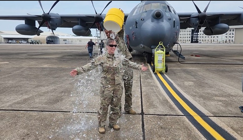 U.S Air Force Maj. Jessica Knizel, Aeromedical Nurse Practitioner Advisor to the Air Force Surgeon General and Wing Surgeon, 492nd Special Operations Wing, participates in a “fini flight” at Eglin Air Force Base, Florida, 2023. The fini flight is a traditional ceremony marking an aircrew member’s final flight or departure from a unit. (Courtesy photo from U.S. Air Force Maj. Jessica Knizel)