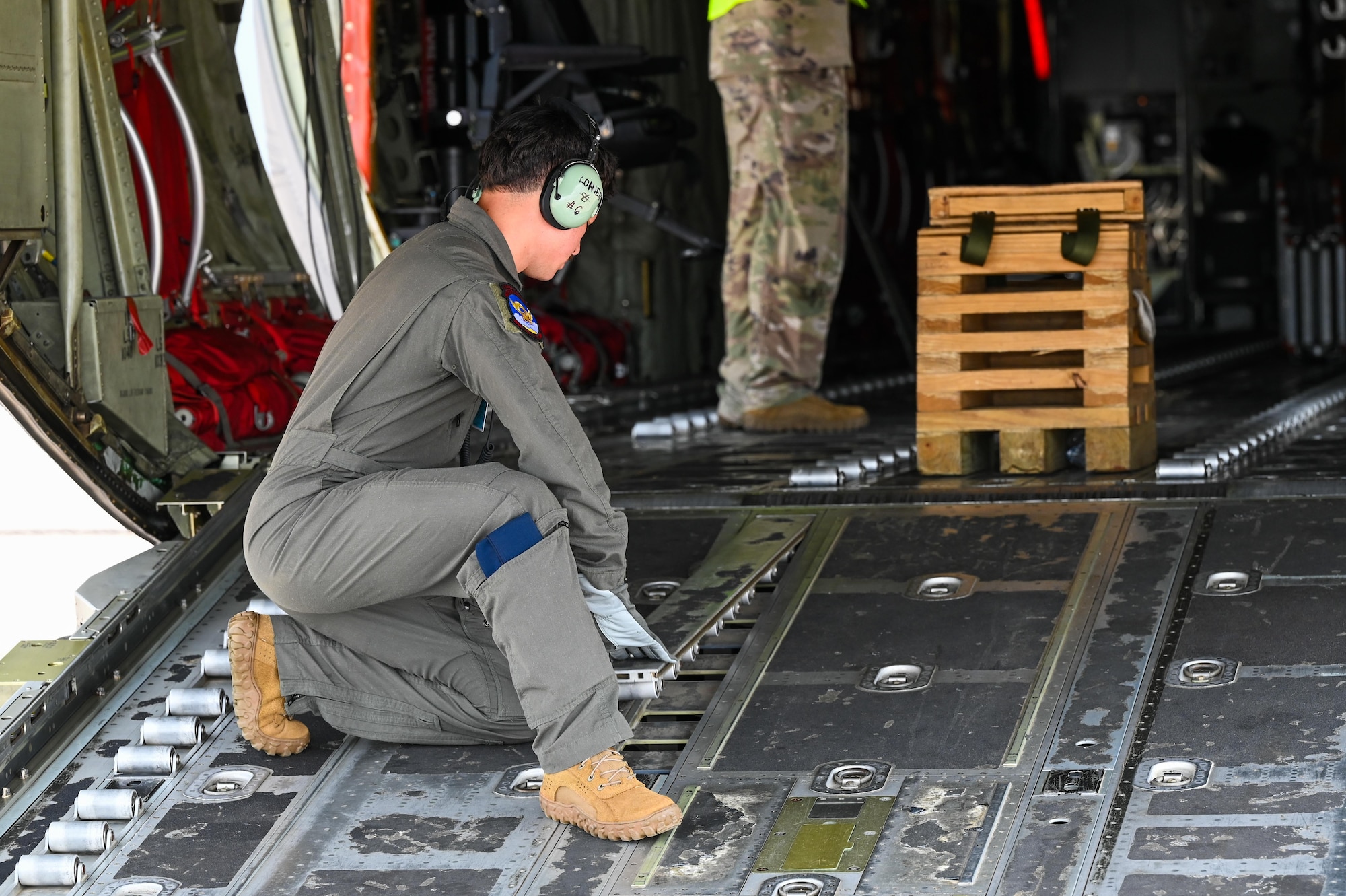 A loadmaster assigned to the 39th Airlift Squadron configures cargo rollers inside a C-130J Super Hercules during a Combat Readiness Inspection at Dyess Air Force Base, Texas, July 1, 2025. The inspection evaluated the 317th Airlift Wing’s ability to rapidly generate and deploy combat-ready airpower in support of global mobility operations. (U.S. Air Force photo by Airman 1st Class Adrien Tran)
