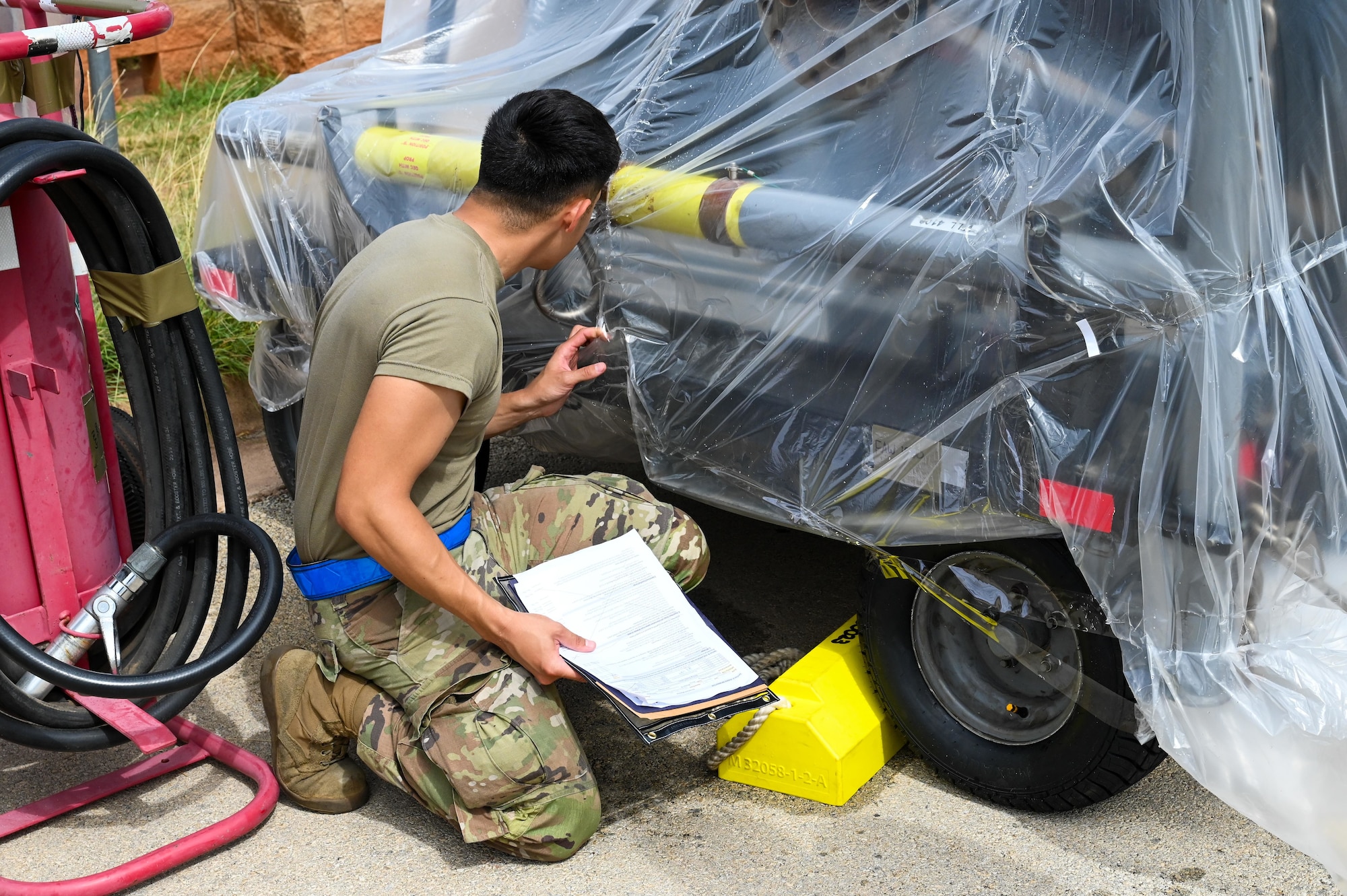 U.S. Air Force Senior Airman Jonathan Contreras, 317th Aircraft Maintenance Squadron support journeyman, verifies cargo weight and documentation during a Combat Readiness Inspection, at Dyess Air Force Base, Texas, July 1, 2025. The inspection tested the 317th Airlift Wing’s ability to rapidly deploy forces in contested and degraded environments. (U.S. Air Force photo by Airman 1st Class Adrien Tran)