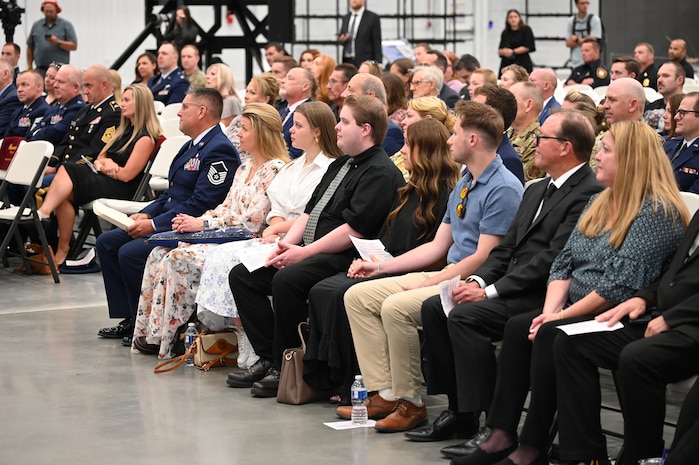 Family members and guests seated at the memorial service.