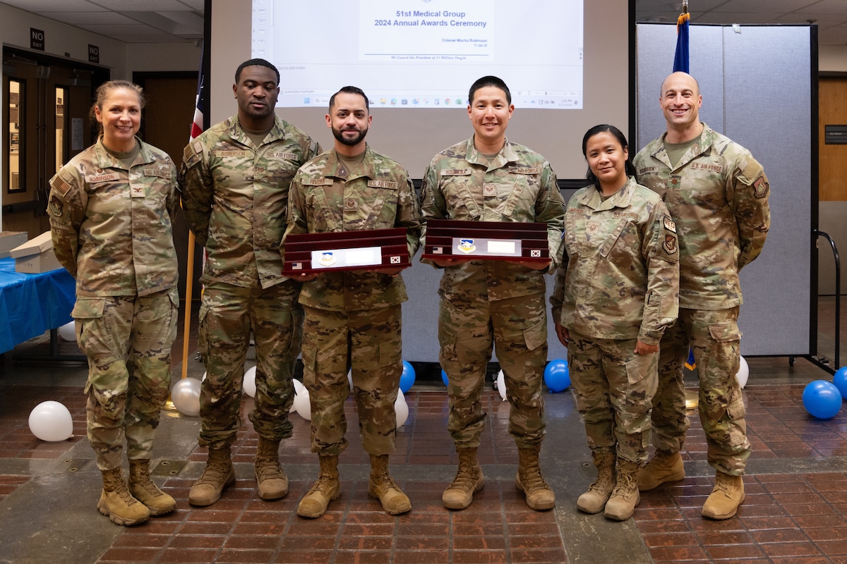 Image of Airmen posing for a photo.