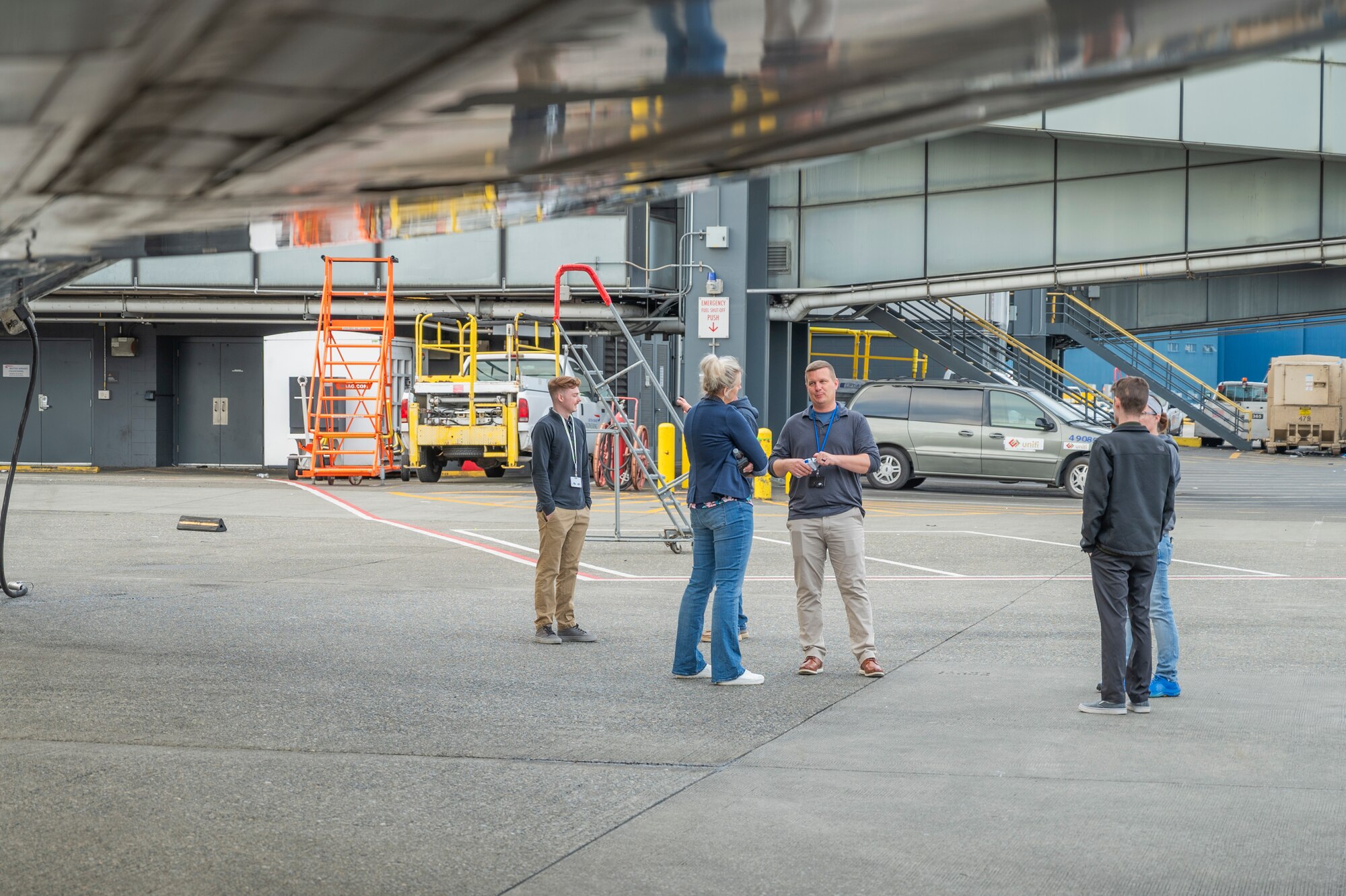 Military and civilian members from the 62d Airlift Wing discuss the Air Mobility Command Seattle Gateway process at the Seattle-Tacoma International Airport, Washington, July 3, 2025.