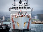 U.S. Coast Guardsmen assigned to medium endurance cutter USCGC Harriet Lane (WMEC 903) prepare to moor the cutter on Joint Base Pearl Harbor-Hickam in Honolulu, Hawaii, July 9, 2025. The crew returned from a 73-day patrol during which they exercised partnerships with Cook Islands, French Polynesia, and New Zealand through bilateral maritime law enforcement agreements. (U.S. Coast Guard photo by Petty Officer 3rd Class Jennifer Nilson)