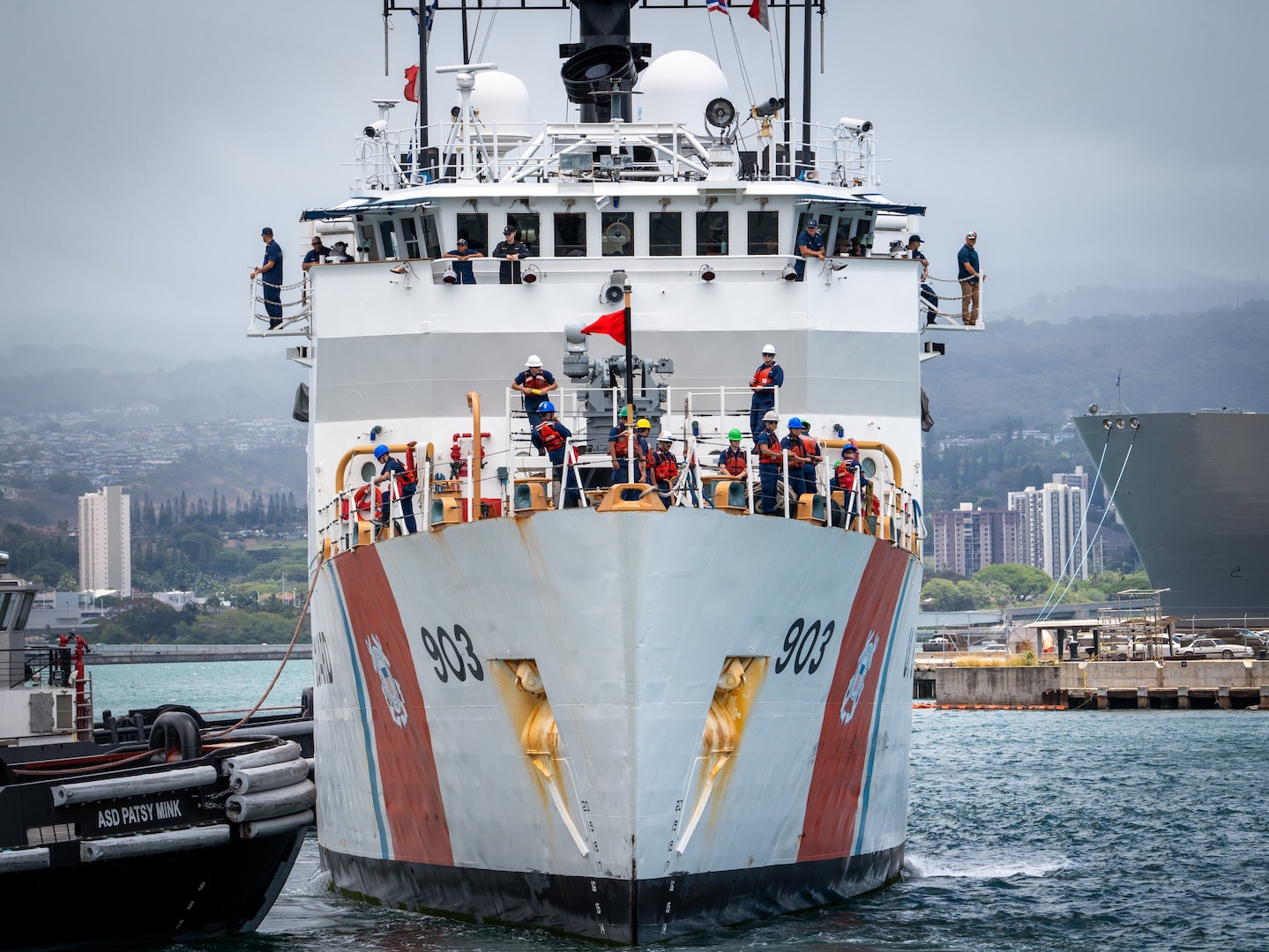 U.S. Coast Guardsmen assigned to medium endurance cutter USCGC Harriet Lane (WMEC 903) prepare to moor the cutter on Joint Base Pearl Harbor-Hickam in Honolulu, Hawaii, July 9, 2025. The crew returned from a 73-day patrol during which they exercised partnerships with Cook Islands, French Polynesia, and New Zealand through bilateral maritime law enforcement agreements. (U.S. Coast Guard photo by Petty Officer 3rd Class Jennifer Nilson)