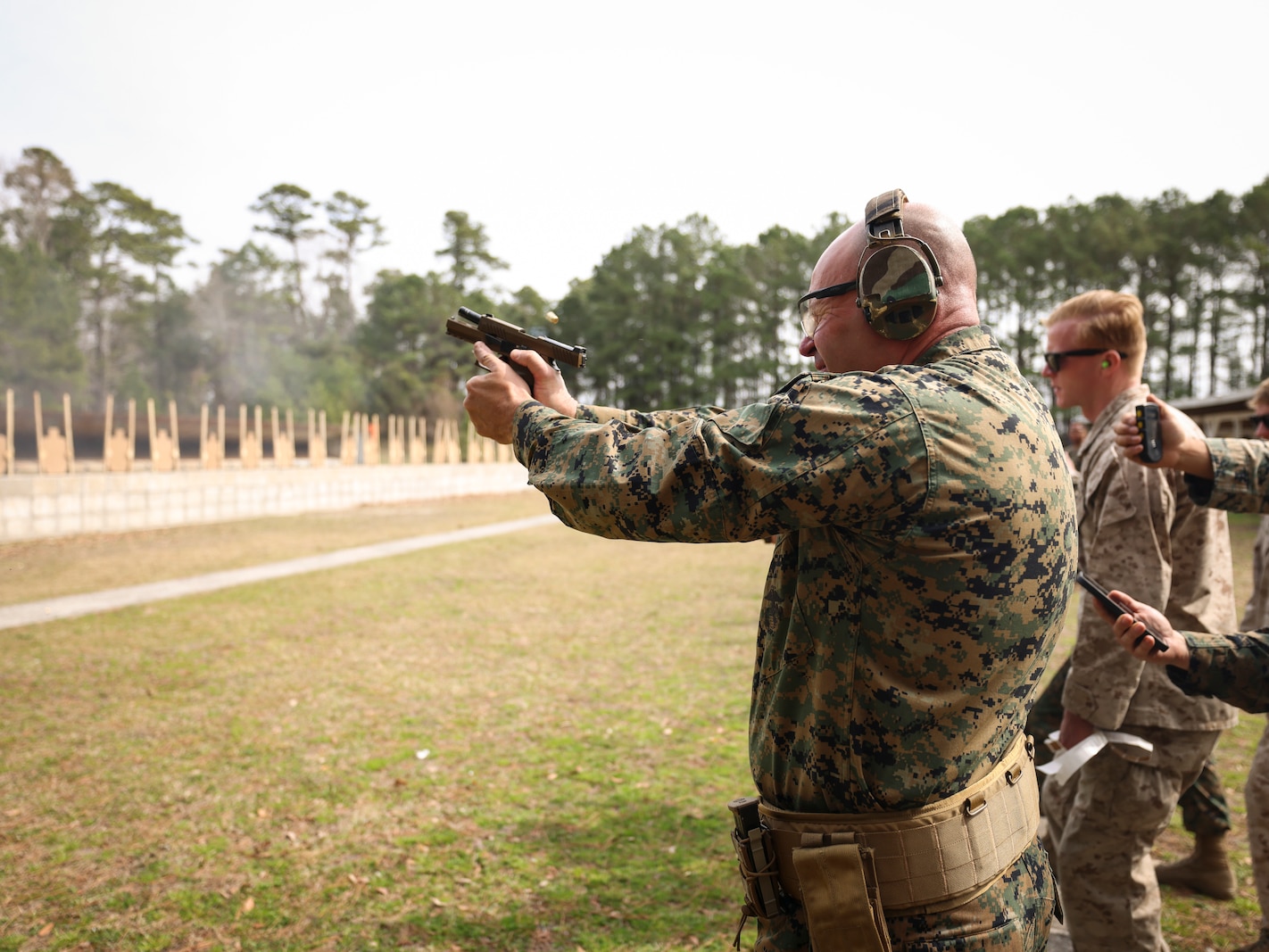U.S. Marine Corps Col. Mark Liston, director of operations for Task Force 51/5th Marine Expeditionary Brigade, fires a M18 pistol from the 25-yard line during the Marine Corps Marksmanship Competition East (MCMC-E) on Stone Bay, Marine Corps Base Camp Lejeune, North Carolina, March 13, 2025. MCMC-E is an annual two-week event held at Weapons Training Battalion on Stone Bay, MCB Camp Lejeune, North Carolina, to improve Marines’ marksmanship, combat readiness, and weapon proficiency. (U.S. Marine Corps photo by Sgt. Angela Wilcox)