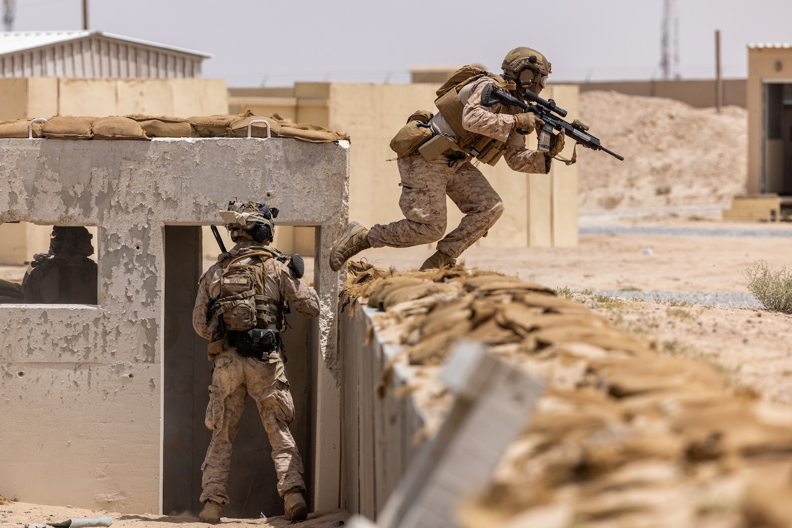 U.S. Marines assigned to Alpha Company, Fleet Anti-Terrorism Security Team Central Command participate in a close quarters battle drill at an urban terrain village training facility. (Official U.S. Army photo)