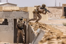 U.S. Marines assigned to Alpha Company, Fleet Anti-Terrorism Security Team Central Command participate in a close quarters battle drill at an urban terrain village training facility. (Official U.S. Army photo)