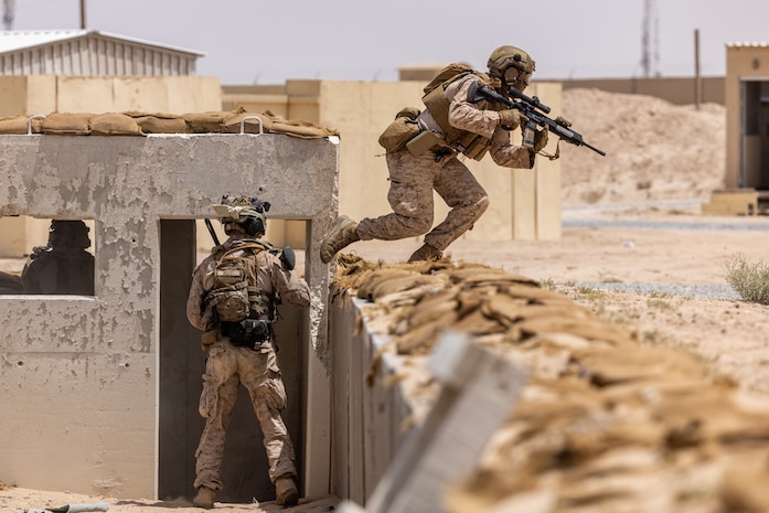 U.S. Marines assigned to Alpha Company, Fleet Anti-Terrorism Security Team Central Command participate in a close quarters battle drill at an urban terrain village training facility. (Official U.S. Army photo)