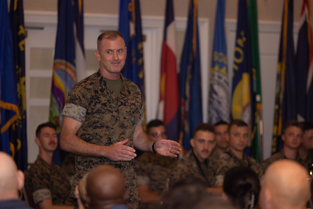 U.S. Marine Corps Sgt. Maj. Liam D. Williams, incoming sergeant major of Marine Corps Base Quantico, addresses attendees during a relief and appointment ceremony at The Clubs at Quantico, on MCB Quantico, Virginia, July 8, 2025. During the ceremony Sgt. Maj. Michael R. Brown was relieved of his duties as sergeant major of MCB Quantico by Williams. (U.S. Marine Corps photo by Lance Cpl. David Brandes)