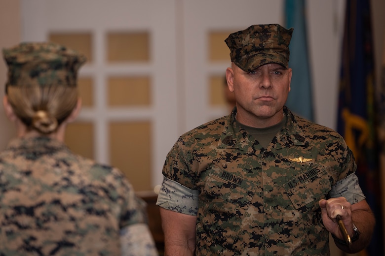 U.S. Marine Corps Sgt. Maj. Michael R. Brown, outgoing sergeant major of Marine Corps Base Quantico, holds the noncommissioned officer’s sword during a relief and appointment ceremony at The Clubs at Quantico on MCB Quantico, Virginia, July 8, 2025. During the ceremony Brown was relieved of his duties as sergeant major of MCB Quantico by Sgt. Maj. Liam D. Williams. (U.S. Marine Corps photo by Lance Cpl. David Brandes)