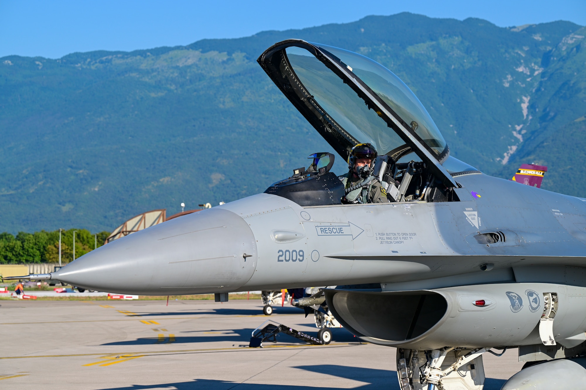 Gen. Clark sits in an F-16.
