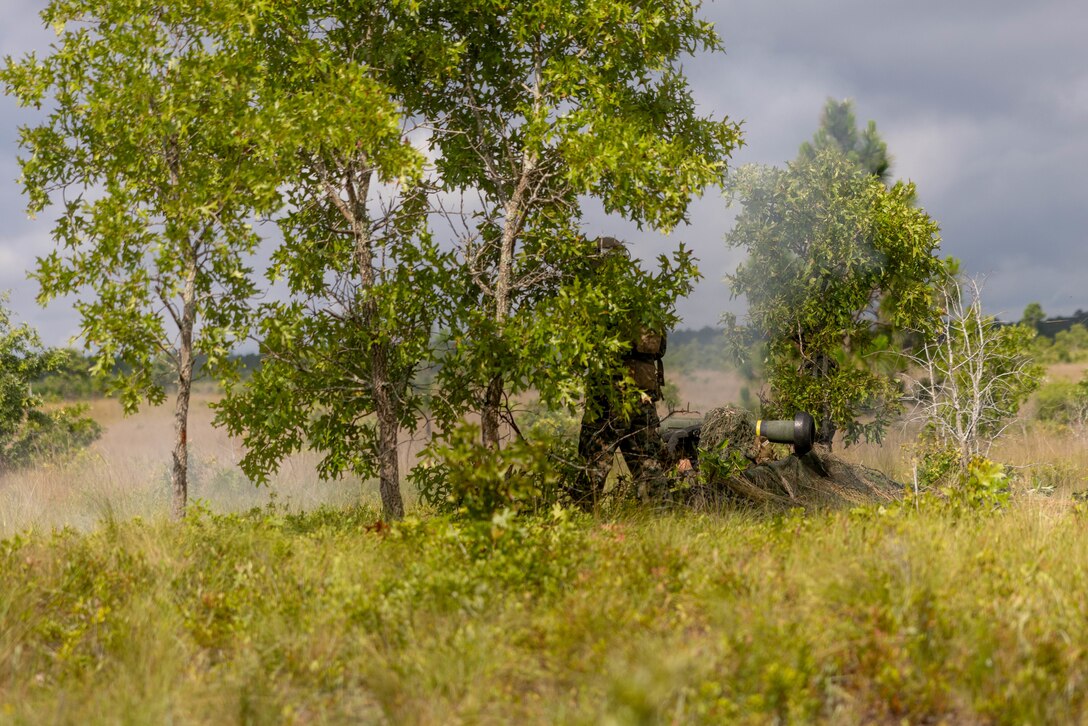 U.S. Marine Corps Sgt. Kai Delp, an instructor with Advanced Infantry Training Battalion, School of Infantry - East, fires an FGM-148 Javelin during a combined arms live-fire training exercise involving the employment of SUAS to deliver munitions on designated targets at Camp Lejeune, North Carolina, July 3, 2025. This event marked the first time munitions were employed from SUAS during a live-fire training exercise on Camp Lejeune, demonstrating the capability of integrating aerial strike capabilities at the tactical level. (U.S. Marine Corps photo by Lance Cpl. Hunter J. Kuester)