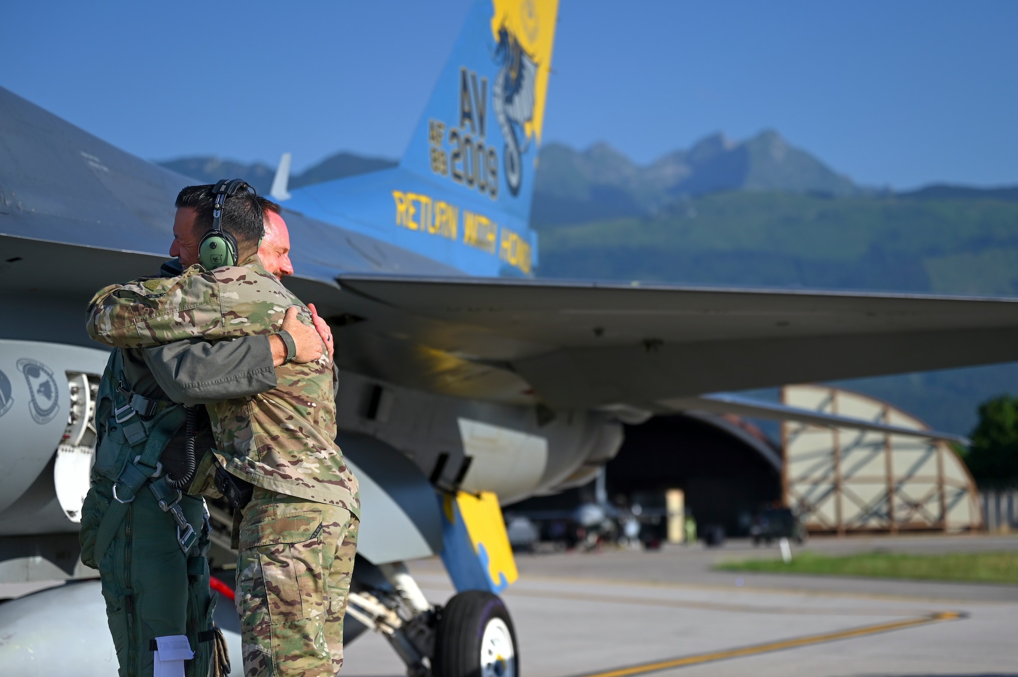 Gen. Clark and Chief Flores embrace each other