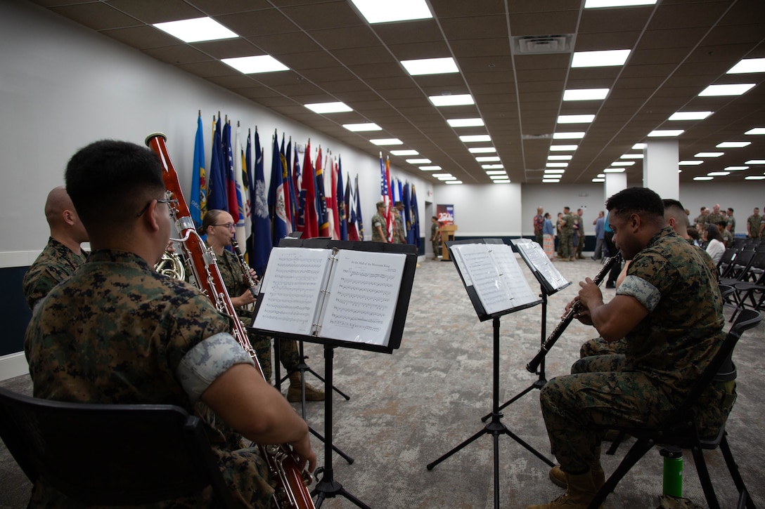 U.S. Marines with the 2nd Marine Division Band perform during the 2nd Network Battalion change of command ceremony at Tun Alley on Marine Corps Base Camp Lejeune, North Carolina, June 13, 2025. The change of command ceremony represents the passing of responsibility, authority and accountability from the outgoing commanding officer to the incoming commanding officer. (U.S. Marine Corps photo by Lance Cpl. Hunter Brock)