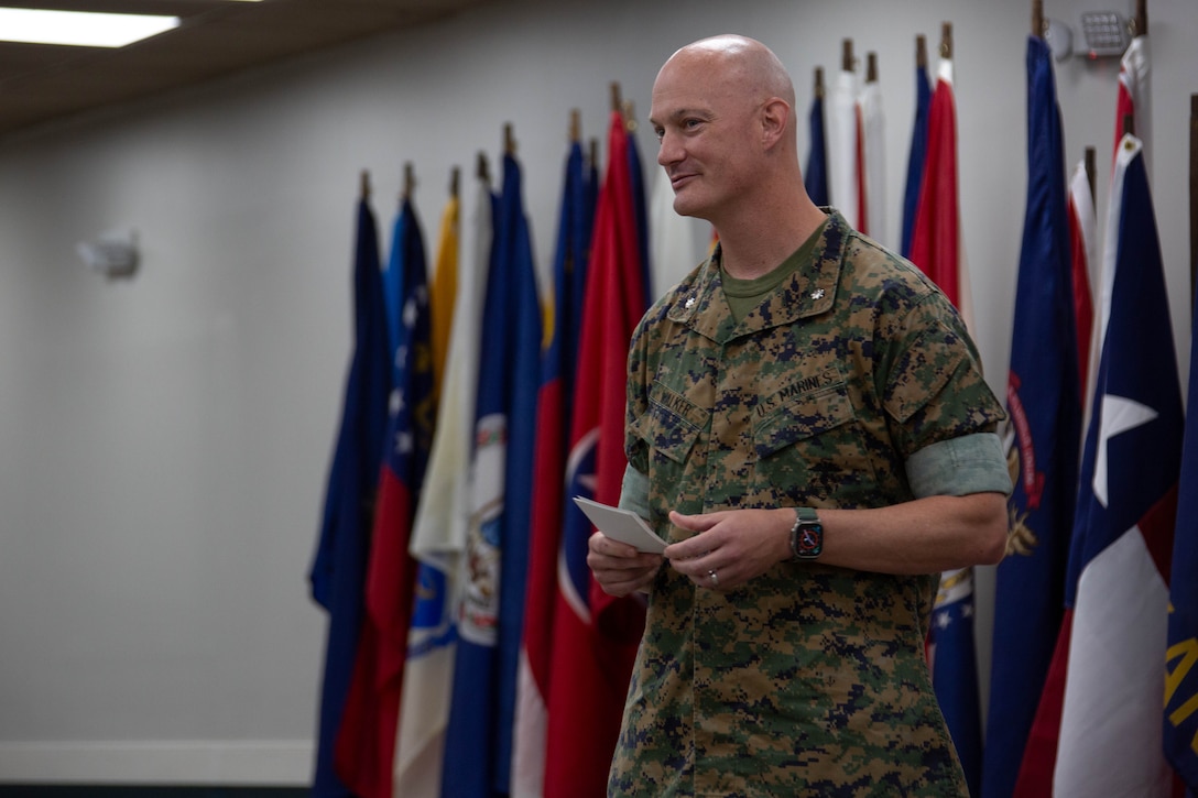 U.S. Marine Corps Lt. Col. Andrew Walker, outgoing commanding officer, 2nd Network Battalion, Marine Corps Cyberspace Operations Group, gives his remarks during the 2nd Network Battalion change of command ceremony on Marine Corps Base Camp Lejeune, North Carolina, June 13, 2025. The change of command ceremony represents the passing of responsibility, authority and accountability from the outgoing commanding officer to the incoming commanding officer. (U.S. Marine Corps photo by Lance Cpl. Hunter Brock)