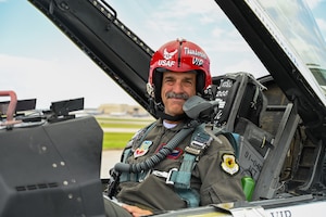Man sits in plane.