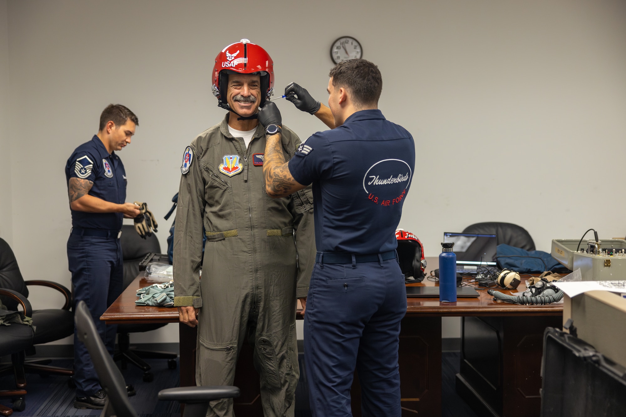 Three men preparing for flight.