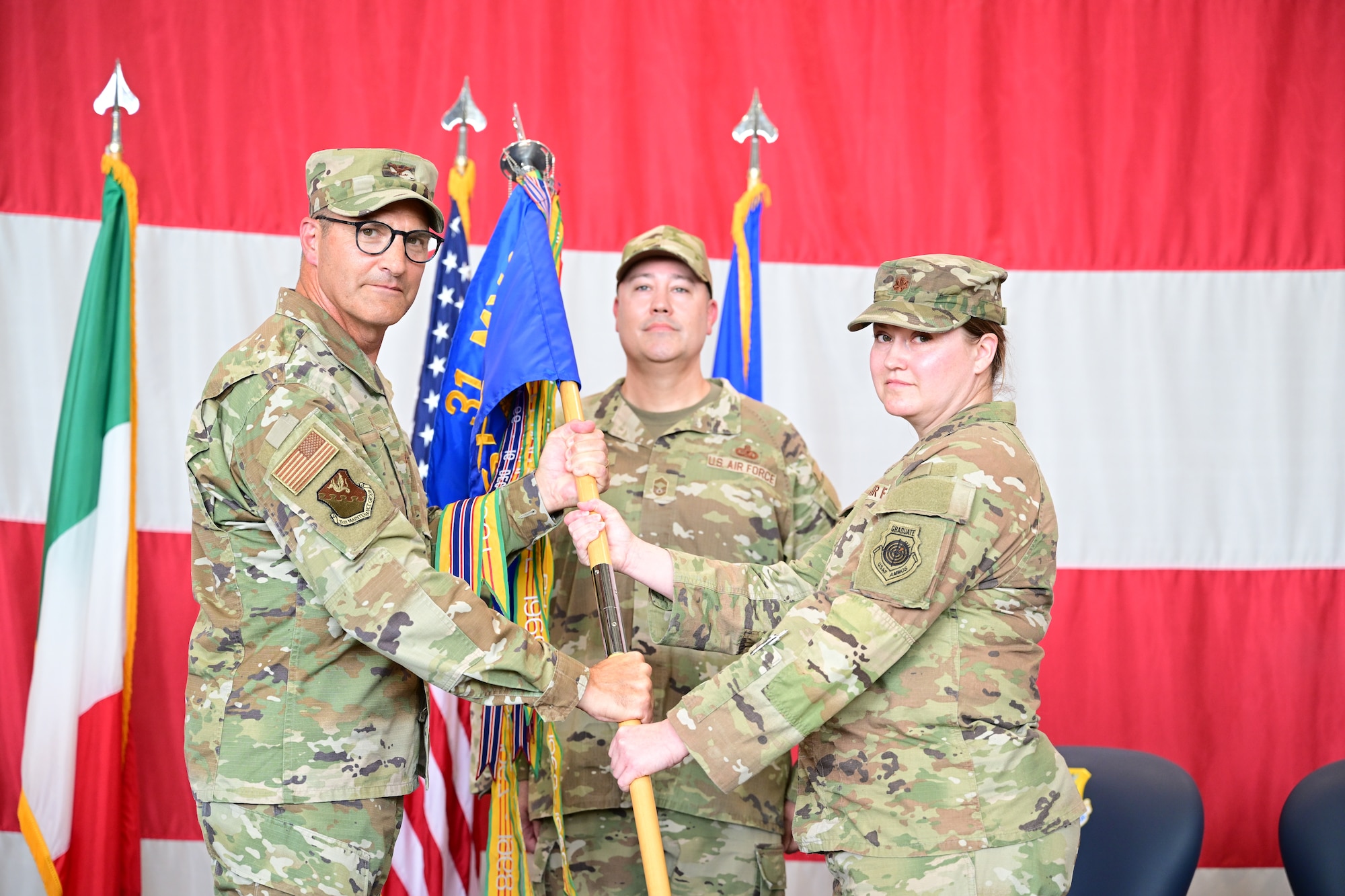 Incoming commander receives guidon during change of command ceremony