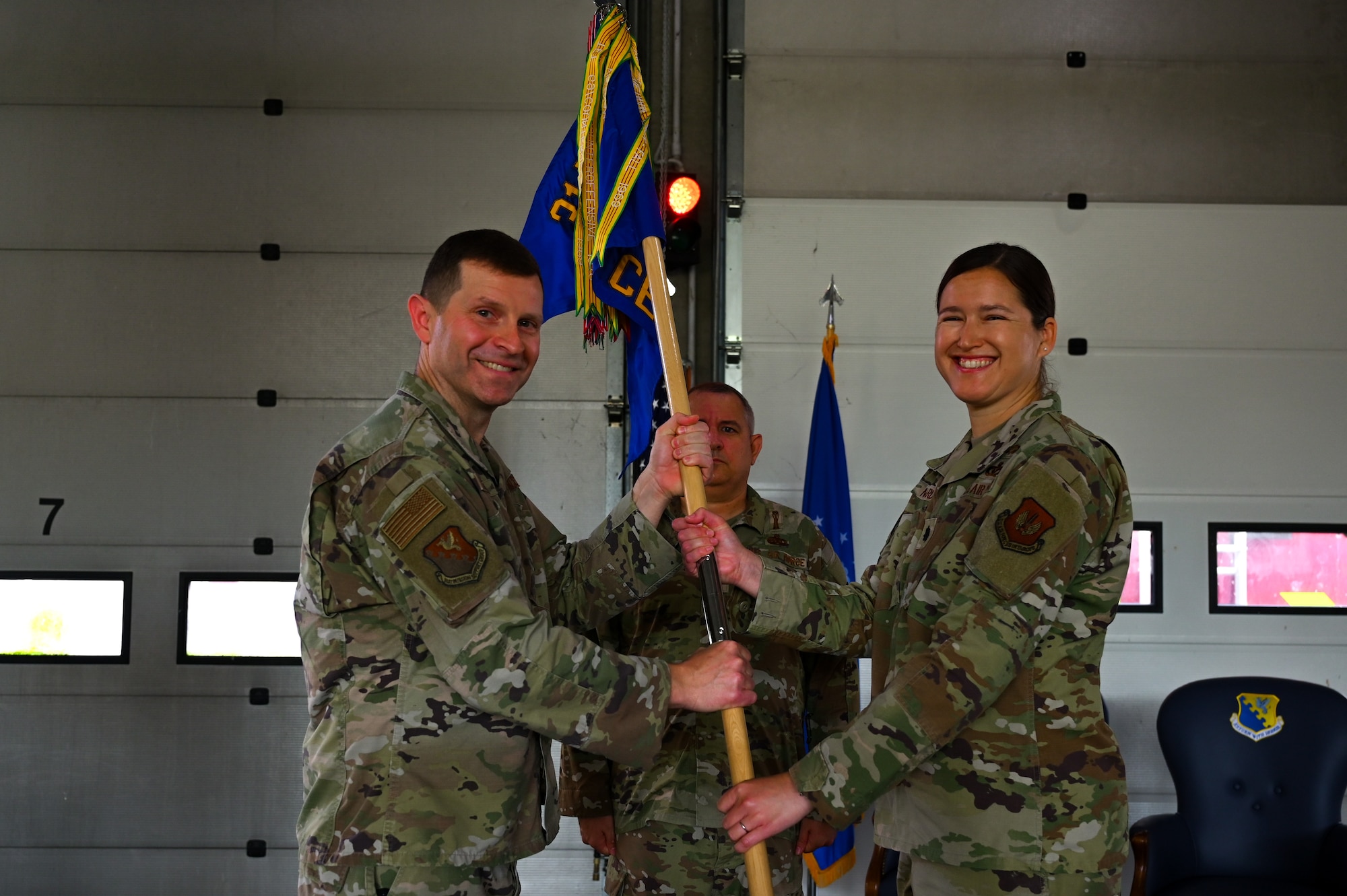 Incoming commander receives guidon during change of command ceremony