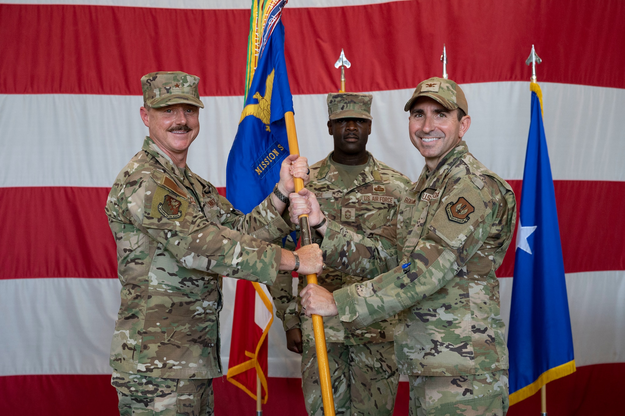 Incoming commander receives guidon during change of command ceremony