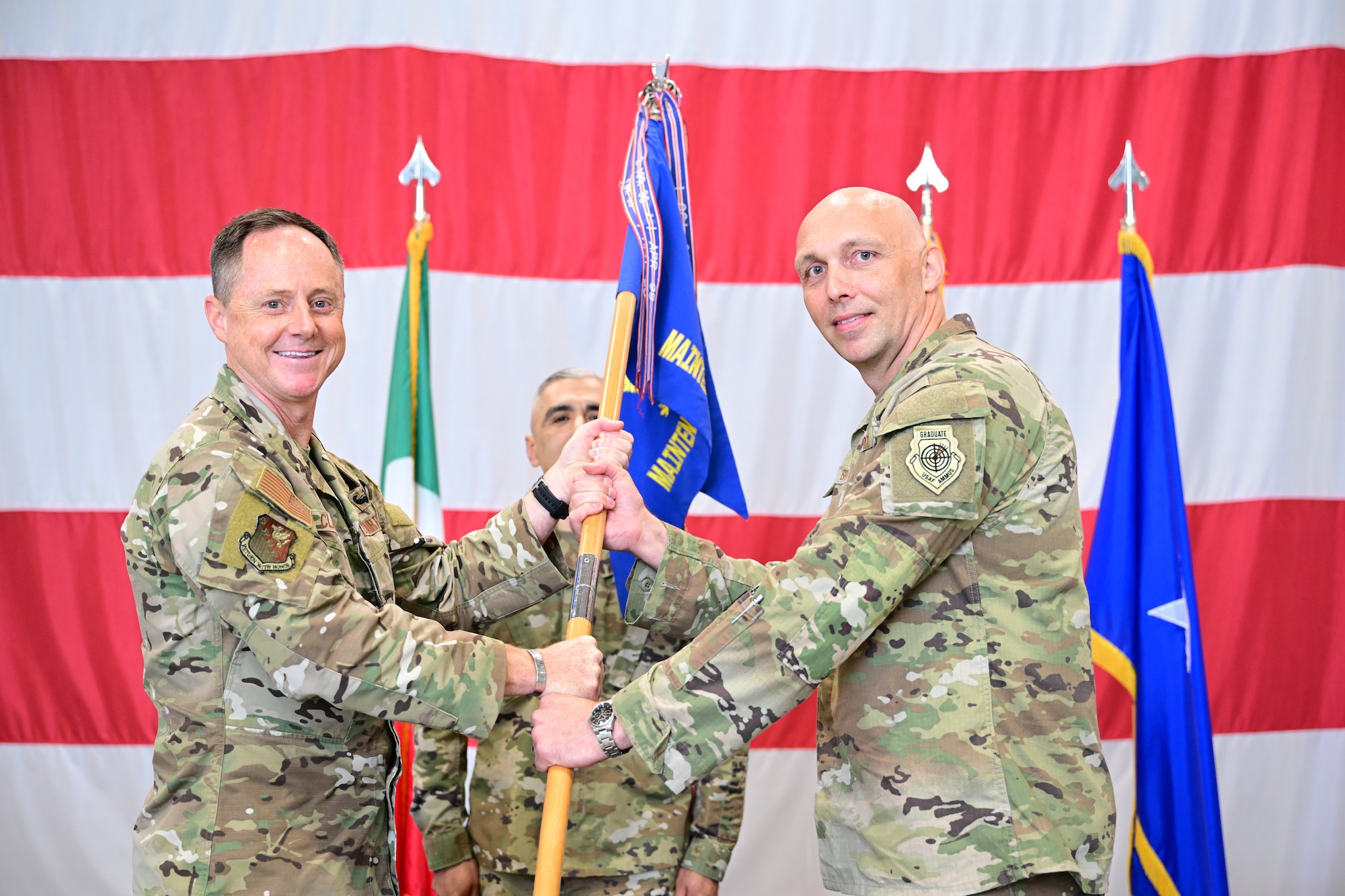 Incoming commander receives guidon during change of command ceremony