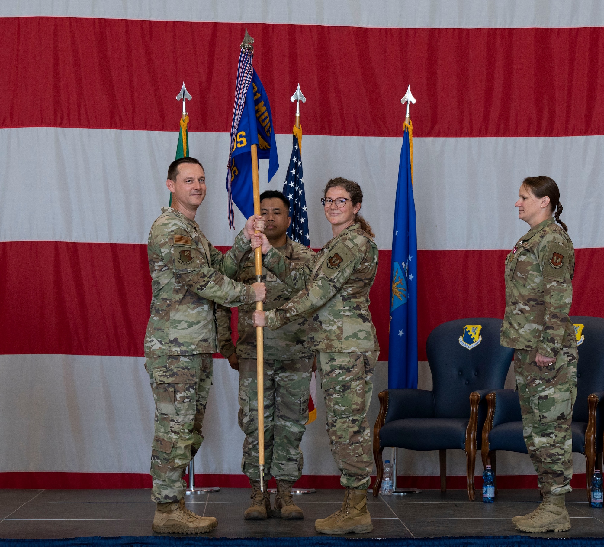 Incoming commander receives guidon during change of command ceremony
