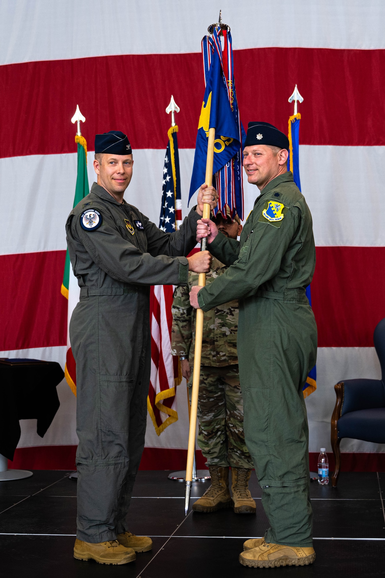 Incoming commander receives guidon during change of command ceremony