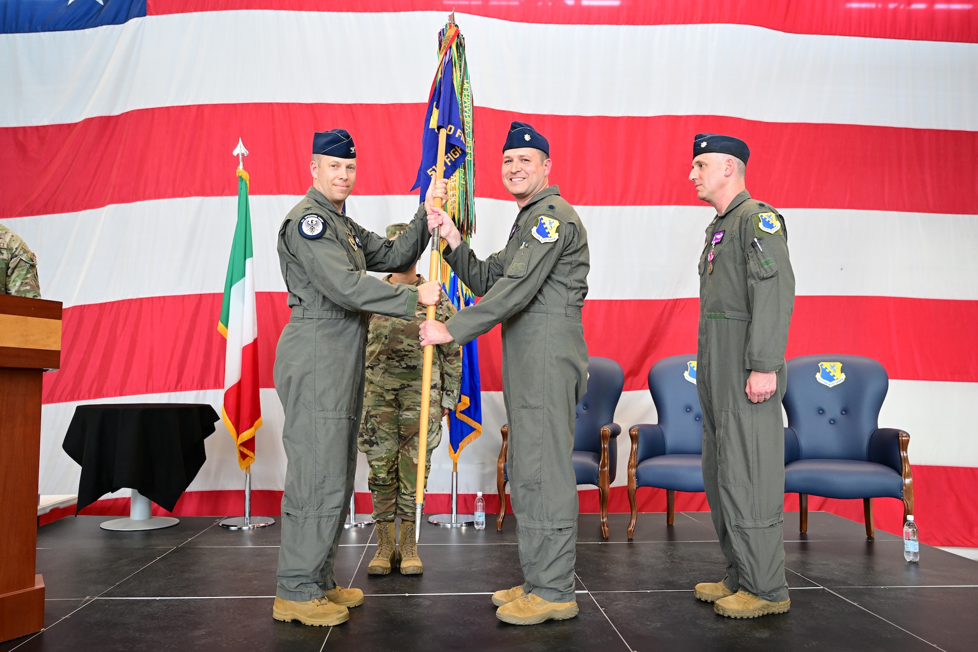 Incoming commander receives guidon during change of command ceremony