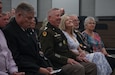 Chaplain (COL) Bill Draper and his wife, Yvonne, laugh at what was being said by Maj. Gen. Haldane Lamberton, Adjutant General-Kentucky, during his retirement ceremony at the Wellman Auditorium June 25, 2025. The ceremony also included Lamberton awarding four former state chaplains with the Order of Martin of Tours medallion for their many years of faithful service. (U.S. Army National Guard photo by Sgt. 1st Class Benjamin Crane)