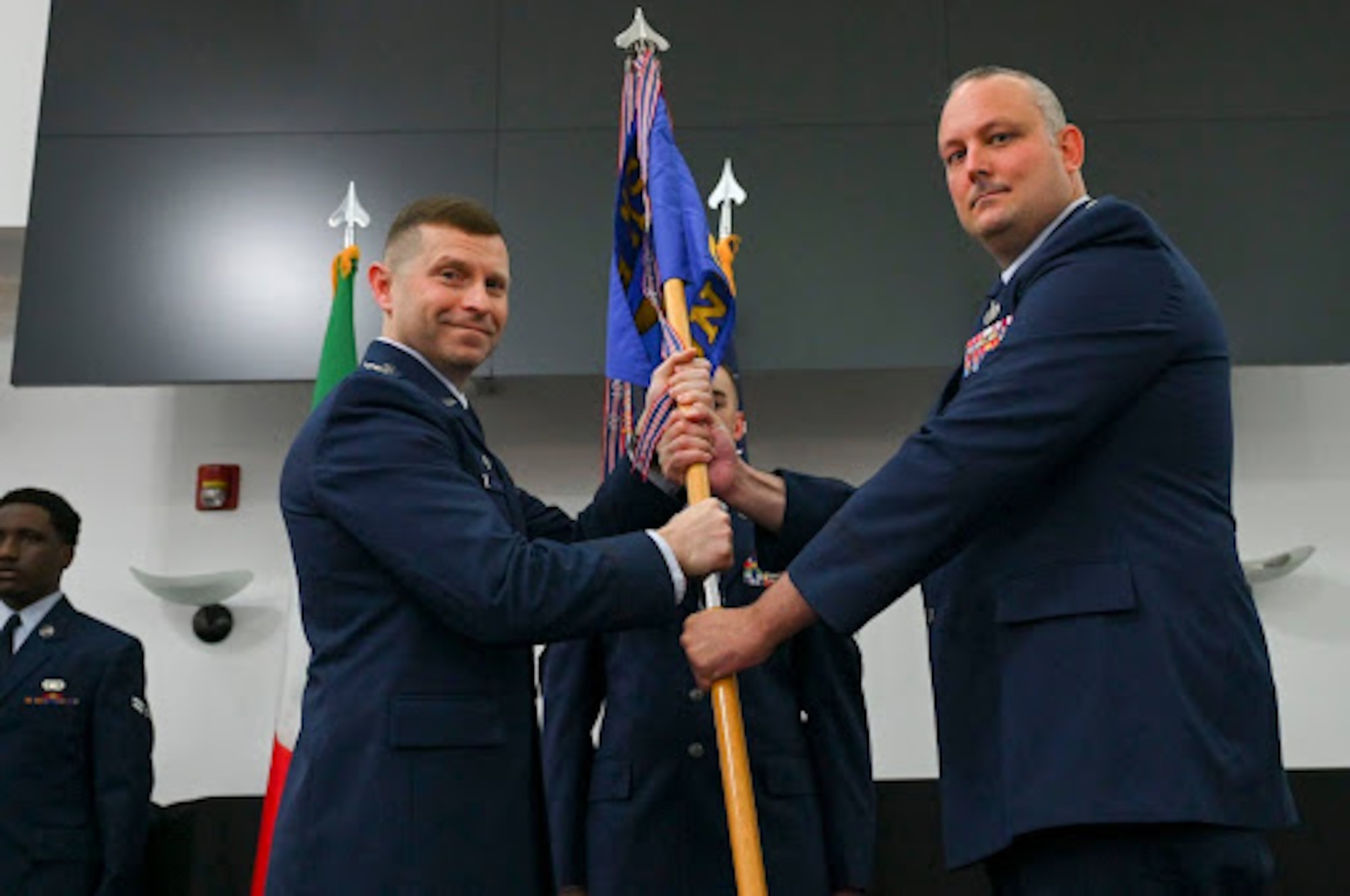 Incoming commander receives guidon during change of command ceremony