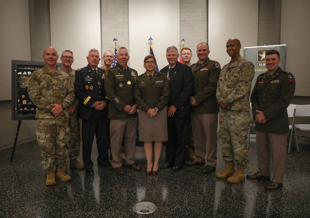 All the chaplains present at the awards ceremony gather for a photo after the award and retirement ceremony at the Wellman Auditorium June 25, 2025.