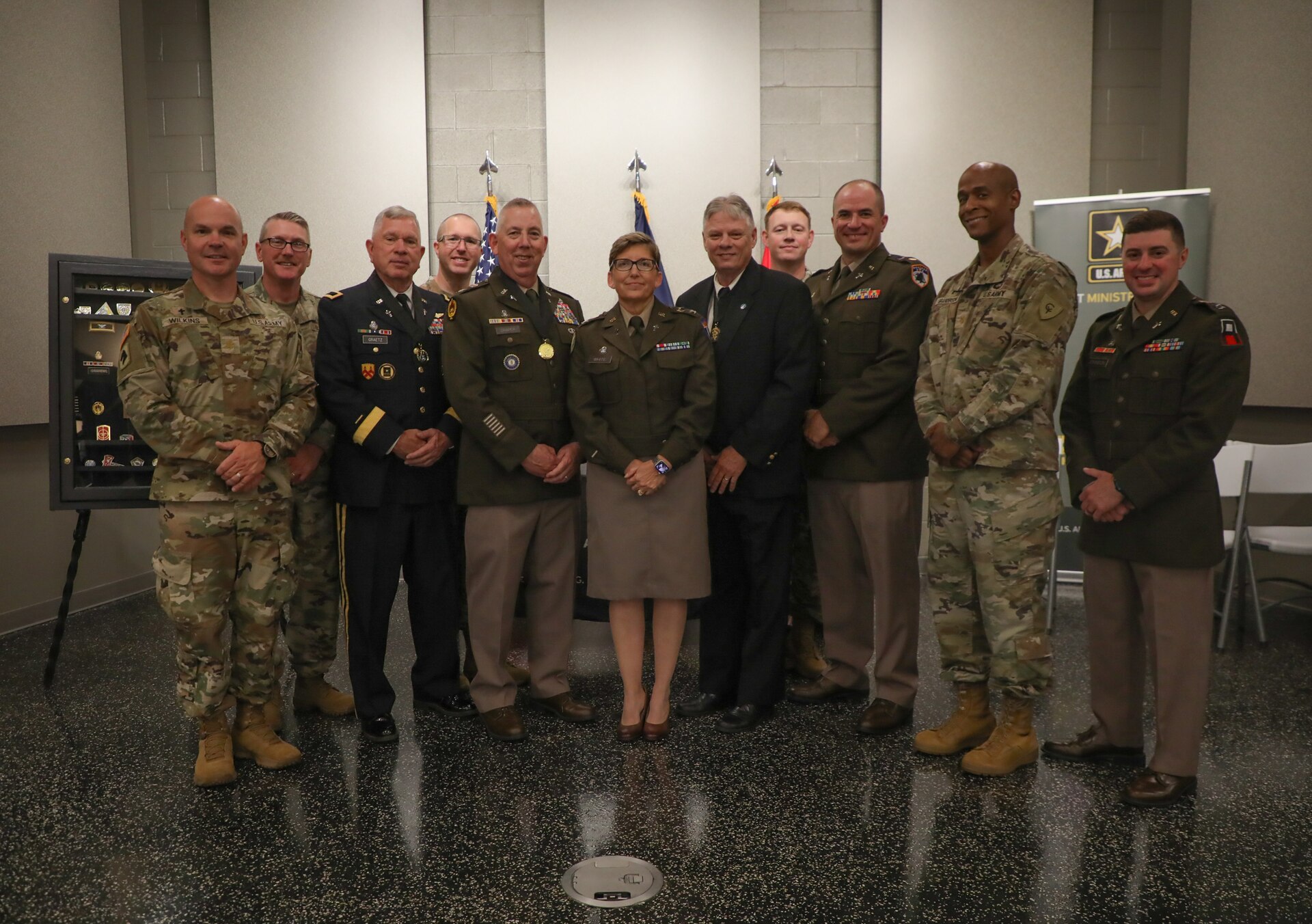 All the chaplains present at the awards ceremony gather for a photo after the award and retirement ceremony at the Wellman Auditorium June 25, 2025.