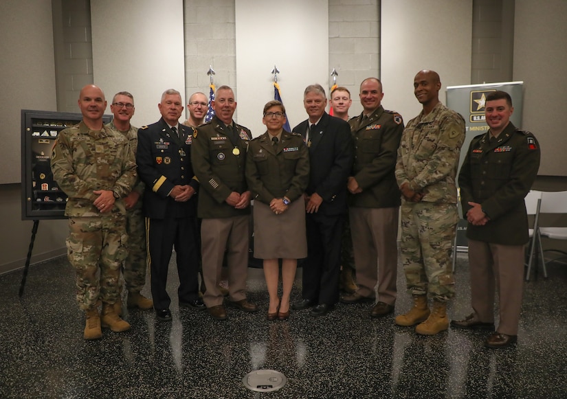 All the chaplains present at the awards ceremony gather for a photo after the award and retirement ceremony at the Wellman Auditorium June 25, 2025.