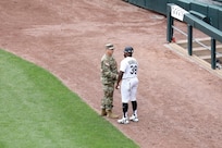 U.S. Army Reserve Sgt. 1st Class Garrett Bisinger, left, currently assigned to First Army as a physical security non-commissioned officer, meets Jason Bourgeois, White Sox first base coach during a ‘Hero of the Game’ on-field recognition at the Chicago White Sox home game, July 9, 2025.