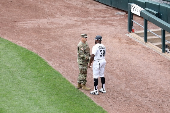 U.S. Army Reserve Sgt. 1st Class Garrett Bisinger, left, currently assigned to First Army as a physical security non-commissioned officer, meets Jason Bourgeois, White Sox first base coach during a ‘Hero of the Game’ on-field recognition at the Chicago White Sox home game, July 9, 2025.