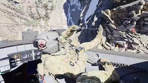Idaho Army National Guard HH-60M Black Hawk helicopter crew conduct a rescue operation July 7, 2025, to assist an injured hiker and her companion near Decker Peak in Idaho. (Photo from video by Mike Freeman)