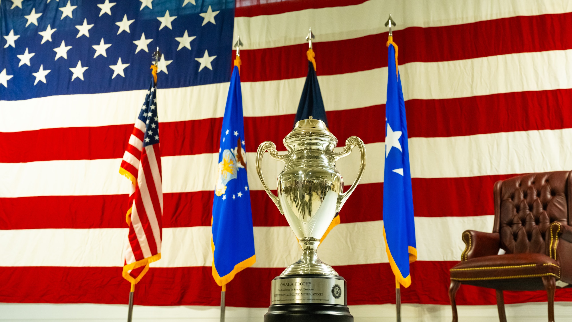 The Omaha Trophy awarded to the 91st Missile Wing, displayed on the Defender Dome stage at Minot Air Force Base, North Dakota, July 9, 2025. This prestigious recognition is given for excellence in areas such as intercontinental ballistic missiles, ballistic missile submarines, strategic bombers, and global operations