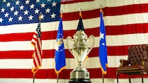 The Omaha Trophy awarded to the 91st Missile Wing, displayed on the Defender Dome stage at Minot Air Force Base, North Dakota, July 9, 2025. This prestigious recognition is given for excellence in areas such as intercontinental ballistic missiles, ballistic missile submarines, strategic bombers, and global operations