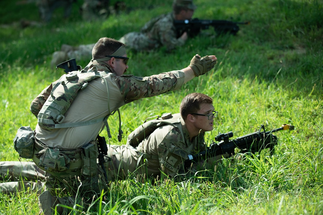 Soldiers of 3rd Platoon, Charlie Company, 1st Battalion, 149th Infantry, practice assault tactics using blank fire ammunition on a training range as a part of the Exportable Combat Training Center (XCTC) exercise at Fort Pickett, Virginia, June 19, 2025.