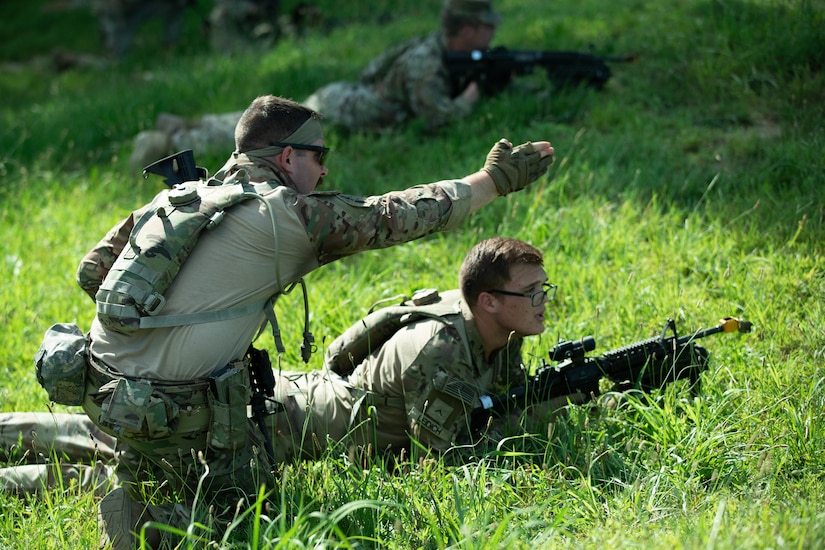 Soldiers of 3rd Platoon, Charlie Company, 1st Battalion, 149th Infantry, practice assault tactics using blank fire ammunition on a training range as a part of the Exportable Combat Training Center (XCTC) exercise at Fort Pickett, Virginia, June 19, 2025.