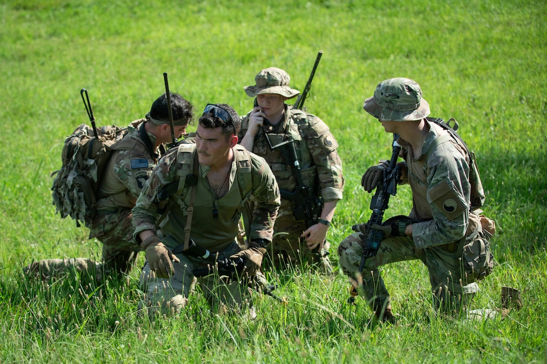 Soldiers of 3rd Platoon, Charlie Company, 1st Battalion, 149th Infantry, conduct a Liquids, Ammunition, Casualties, and Equipment (LACE) report during an assault training lane during the Exportable Combat Training Center (XCTC) exercise at Fort Pickett, Virginia, June 19, 2025.