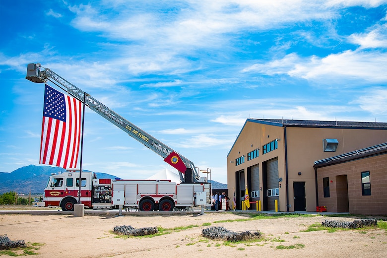 The American flag flies from one of the fire engines during the ribbon cutting ceremony for Fire Station #3 at Kirtland Air Force Base, June 13, 2025.